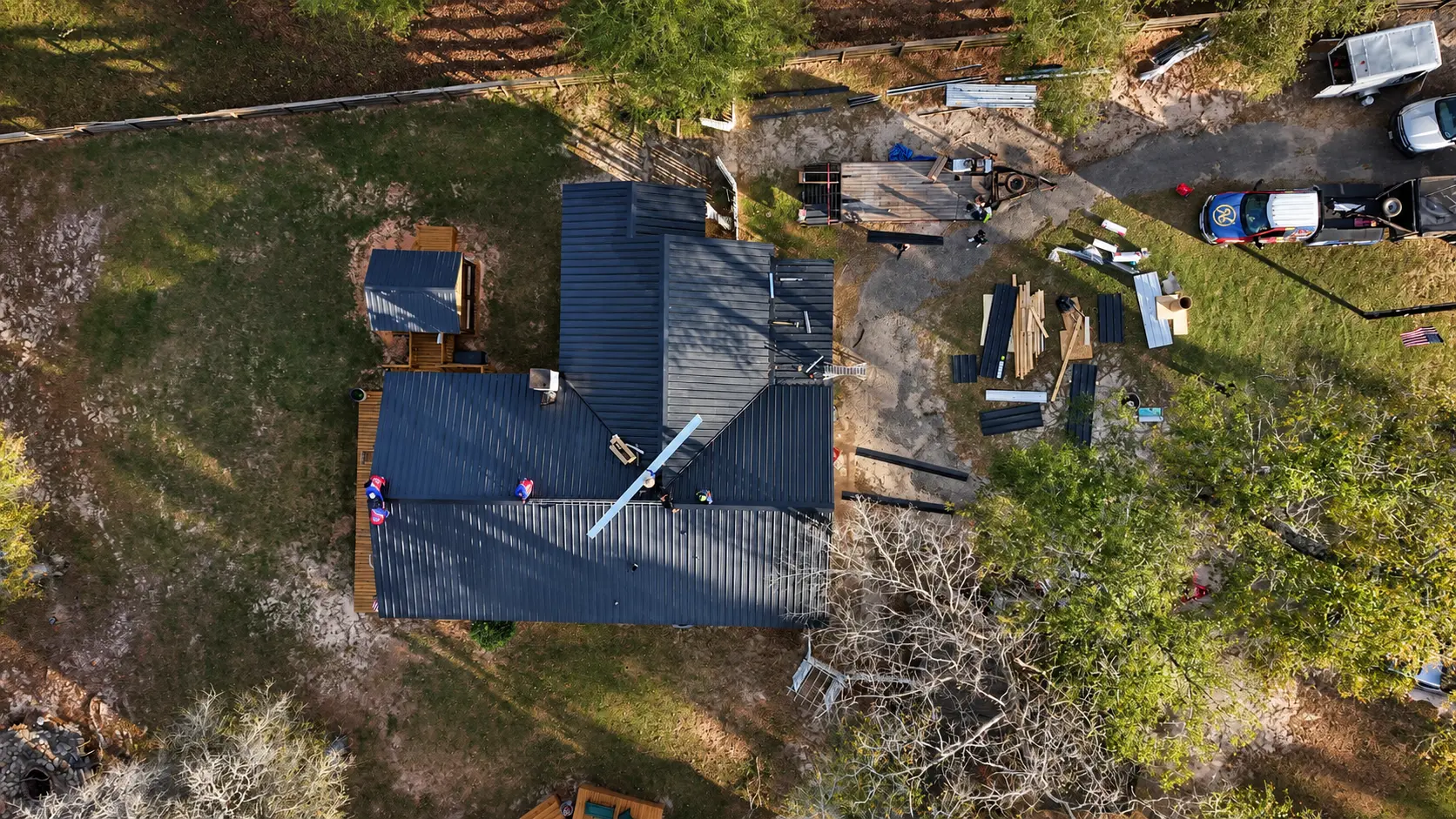 Aerial top-down view of the crew installing a metal roof in East Texas