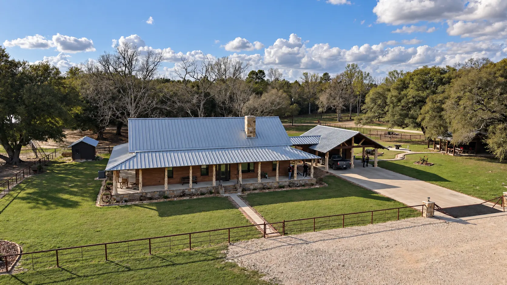 Aerial view of a new metal roof on a ranch home in East Texas
