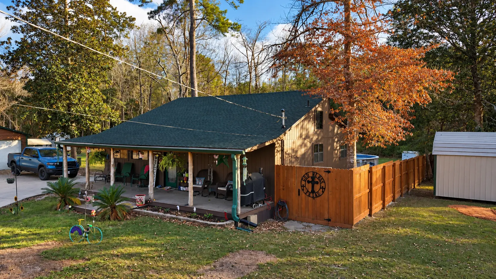 Shingle roof on a lake cabin with a covered porch in East Texas