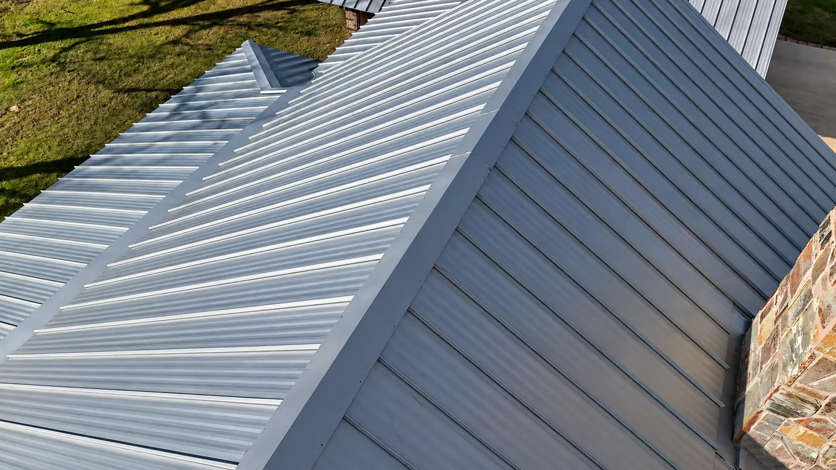Close-up of new standing seam metal roof panels and seams
